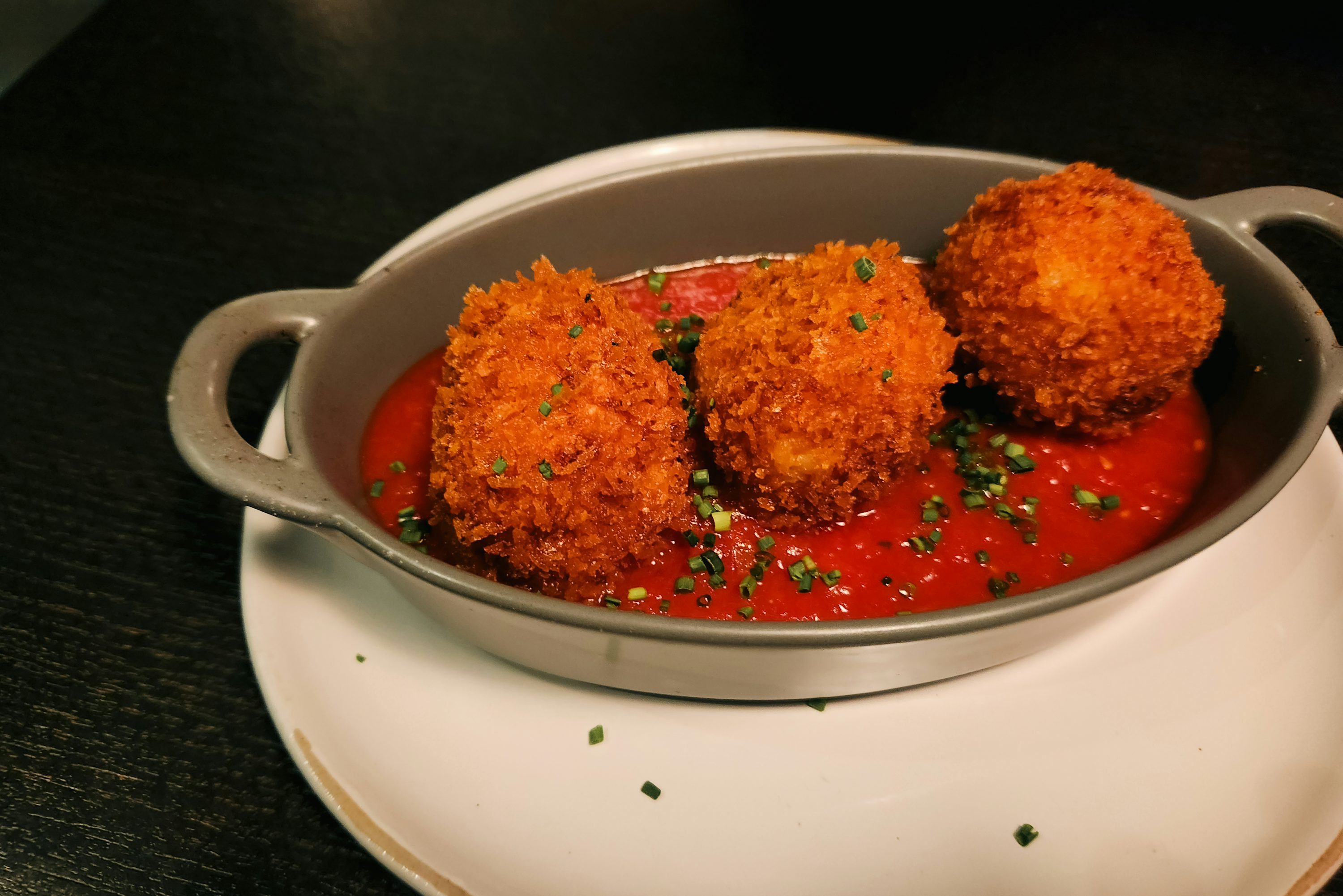 Golden crumbed arancini balls